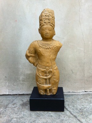brown stone buddha on stand